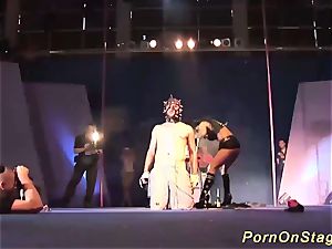 extraordinary fetish display on public demonstrate stage