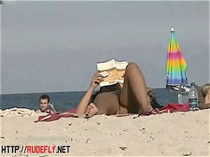 steaming honeys filmed lying on a naturist beach